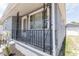Home's front porch features decorative railings, adding a touch of elegance to the entrance at 3253 57Th N Ave, St Petersburg, FL 33714