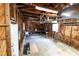 Spacious garage featuring wooden walls, concrete floor, and workbench at 3253 57Th N Ave, St Petersburg, FL 33714