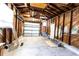 Spacious garage featuring wooden walls and concrete floor at 3253 57Th N Ave, St Petersburg, FL 33714