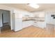 Bright kitchen with granite countertops, white cabinets, and stainless steel appliances at 3253 57Th N Ave, St Petersburg, FL 33714