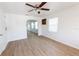 Bright, open living room with wood floors, ceiling fan, and an inviting atmosphere at 3253 57Th N Ave, St Petersburg, FL 33714