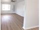 Bright living room with wood floors, large windows and ceiling fan at 3253 57Th N Ave, St Petersburg, FL 33714