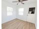 Cozy living room features wood floors, large window and ceiling fan at 3253 57Th N Ave, St Petersburg, FL 33714