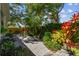 Backyard patio with chairs, landscaping, and lush greenery at 3311 Home Ct, Tampa, FL 33611