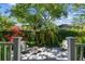Backyard patio with chairs, landscaping, and lush greenery at 3311 Home Ct, Tampa, FL 33611