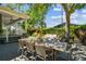 Relaxing outdoor dining area with a table that seats six surrounded by mature trees at 3311 Home Ct, Tampa, FL 33611