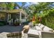 Inviting outdoor patio featuring a comfortable seating area and lush landscaping at 3311 Home Ct, Tampa, FL 33611