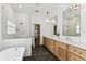 Well-lit bathroom showcasing double vanity, glass shower, and shiplap accent wall at 3311 Home Ct, Tampa, FL 33611
