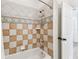 Cozy bathroom featuring tiled shower, stylish fixtures, and white cabinets at 3311 Home Ct, Tampa, FL 33611
