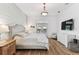 Bright bedroom with shiplap accent wall, wood floors, and natural light at 3311 Home Ct, Tampa, FL 33611
