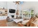 Inviting living room with a white fireplace, high ceilings, and French doors leading outside at 3311 Home Ct, Tampa, FL 33611