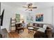 Comfortable living room with hardwood floors, stylish seating, and a large sectional couch at 3311 Home Ct, Tampa, FL 33611