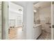 Bright office space featuring hardwood floors and a view into the connected bathroom at 3311 Home Ct, Tampa, FL 33611