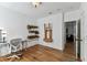 Bright office with hardwood floors, a white desk, and wall-mounted storage solutions for organization at 3311 Home Ct, Tampa, FL 33611