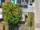 Bird's eye view of the home with a big tree and surrounding neighborhood at 3338 Hoover Dr, Holiday, FL 34691