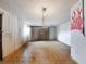 Cleaned-out basement space with painted walls, tile flooring, and a painted mural on the wall at 3338 Hoover Dr, Holiday, FL 34691