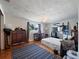 Bedroom with a window, wooden floors, ceiling fan, and some furnishings at 3338 Hoover Dr, Holiday, FL 34691