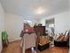 This bedroom is filled with boxes and various items, showing its spacious layout and natural lighting at 3338 Hoover Dr, Holiday, FL 34691