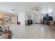 Open floor plan with combined living and kitchen space, showcasing tile floors at 3338 Hoover Dr, Holiday, FL 34691