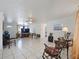 Bright living room with neutral walls, tile flooring, and a ceiling fan at 3338 Hoover Dr, Holiday, FL 34691