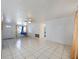 Clean living room featuring tile floors, ceiling fan, and natural light at 3338 Hoover Dr, Holiday, FL 34691