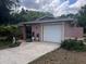 Charming single-story home with a well-maintained front yard and a one-car garage at 33640 Brisk Dr, Wesley Chapel, FL 33543
