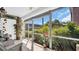Bright patio with screened windows and chairs overlooking the surrounding greenery at 3815 35Th S Way # 102, St Petersburg, FL 33711