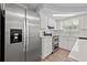 Well-equipped kitchen featuring stainless steel appliances, stone countertops, and a bright skylight at 4220 Oakfield Ave, Holiday, FL 34691