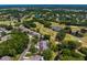 Bird's-eye view of homes alongside a golf course with ponds and mature trees at 4240 Golf Club Ln, Tampa, FL 33618