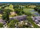 Community homes with views of golf course, ponds, and mature landscaping at 4240 Golf Club Ln, Tampa, FL 33618