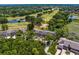 Expansive aerial view of community featuring golf course, lush landscaping, and ponds at 4240 Golf Club Ln, Tampa, FL 33618