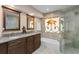 Bathroom with a soaking tub and large glass enclosed shower at 4240 Golf Club Ln, Tampa, FL 33618