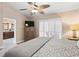 Primary bedroom with a ceiling fan and Primary bath access at 4240 Golf Club Ln, Tampa, FL 33618