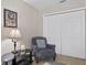 Comfortable sitting area in a bedroom with a dark glass table at 4240 Golf Club Ln, Tampa, FL 33618