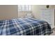 Bright bedroom with a large bed and white furniture at 4240 Golf Club Ln, Tampa, FL 33618