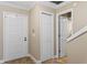 Bright entryway featuring white doors, neutral walls, and a tile floor at 4240 Golf Club Ln, Tampa, FL 33618