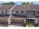 Exterior shot of two-story townhome with attached garage and well-kept landscaping at 4240 Golf Club Ln, Tampa, FL 33618