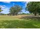 Image of golf course with lush green grass and trees at 4240 Golf Club Ln, Tampa, FL 33618