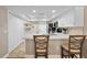 Bright, open kitchen featuring white cabinets, quartz countertops, and stainless steel appliances at 4240 Golf Club Ln, Tampa, FL 33618