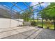 Enclosed lanai with brick floor offering views of the golf course at 4240 Golf Club Ln, Tampa, FL 33618