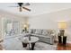 Cozy living room features a sliding glass door and a comfortable seating area at 4240 Golf Club Ln, Tampa, FL 33618