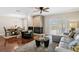 Inviting living room area with a stone fireplace and sliding glass doors to the patio at 4240 Golf Club Ln, Tampa, FL 33618