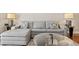 Comfortable living room setting with a plush sofa, glass table, and decorative lamps at 4240 Golf Club Ln, Tampa, FL 33618