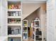 Spacious walk-in pantry with organized shelving for ample storage at 4240 Golf Club Ln, Tampa, FL 33618