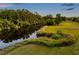 An aerial view shows a tranquil river winding through a lush, green landscape at 4301 Avanti Cir, New Port Richey, FL 34655