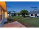 The backyard has well-maintained landscaping between the residences and a concrete patio area at 4301 Avanti Cir, New Port Richey, FL 34655