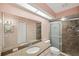 Granite counter tops accent the large Primary bath with shower and decorative tile at 4301 Avanti Cir, New Port Richey, FL 34655