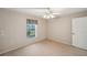This bedroom has wood-look floors and a large window at 4301 Avanti Cir, New Port Richey, FL 34655