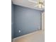 Bedroom featuring ceiling fan, light blue walls, and electrical outlet at 4301 Avanti Cir, New Port Richey, FL 34655