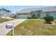 Inviting home with a two-car garage, lush lawn and a mailbox with the house number at 4301 Avanti Cir, New Port Richey, FL 34655